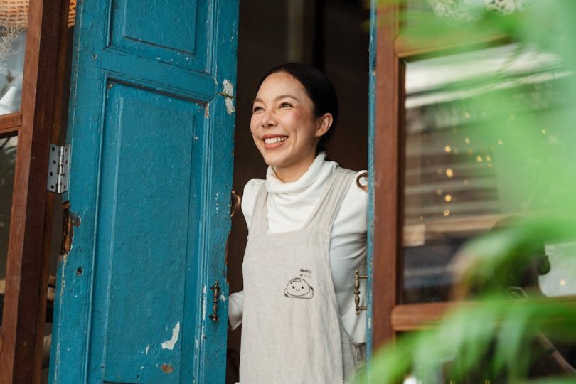 women standing on door