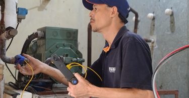 technician checking appliance